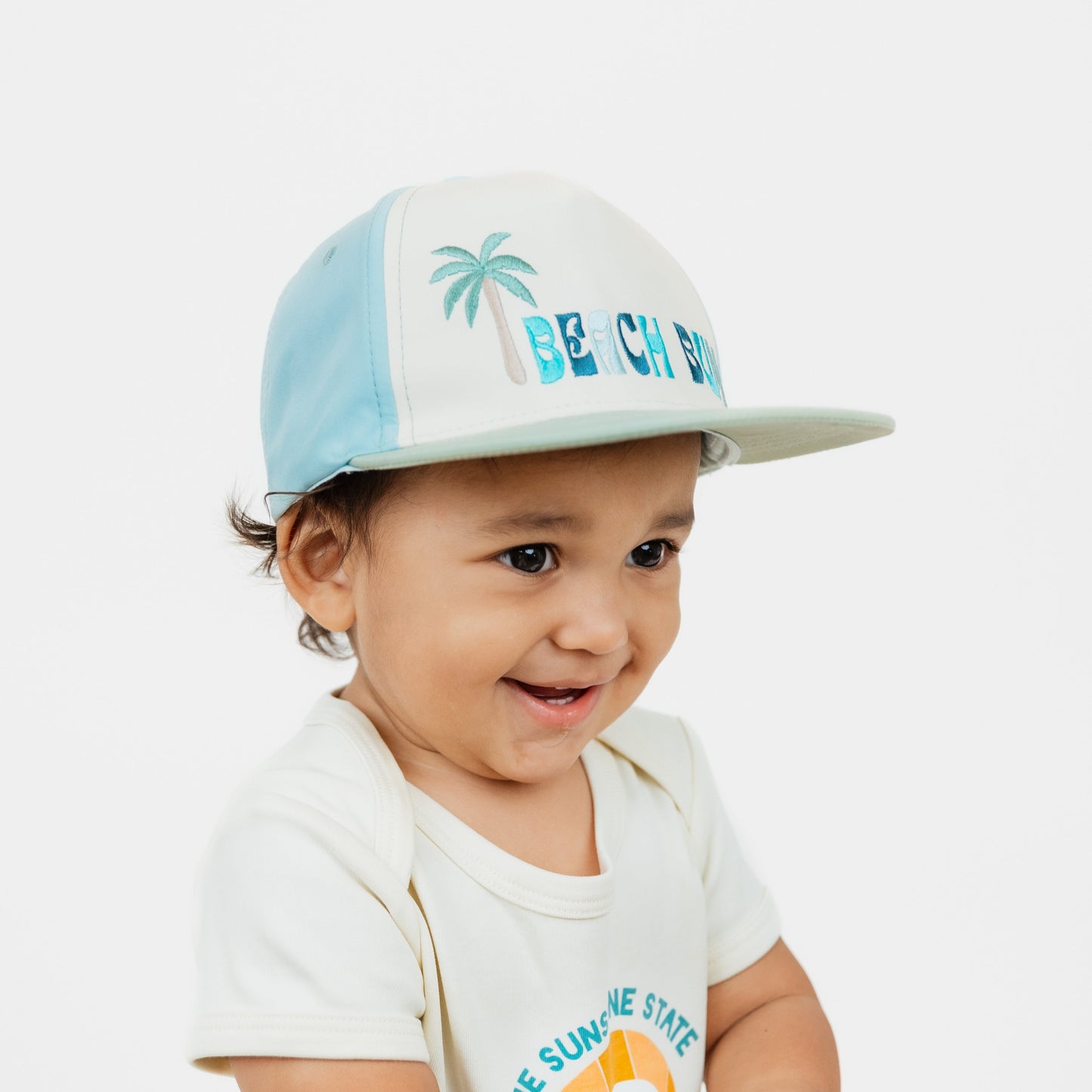 Kid wearing our Beach Bum Snapback Hat.