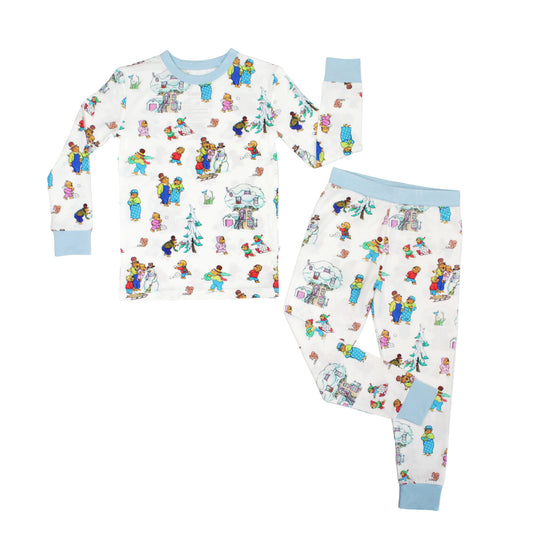 Children's pajama set with colorful character print on a white background