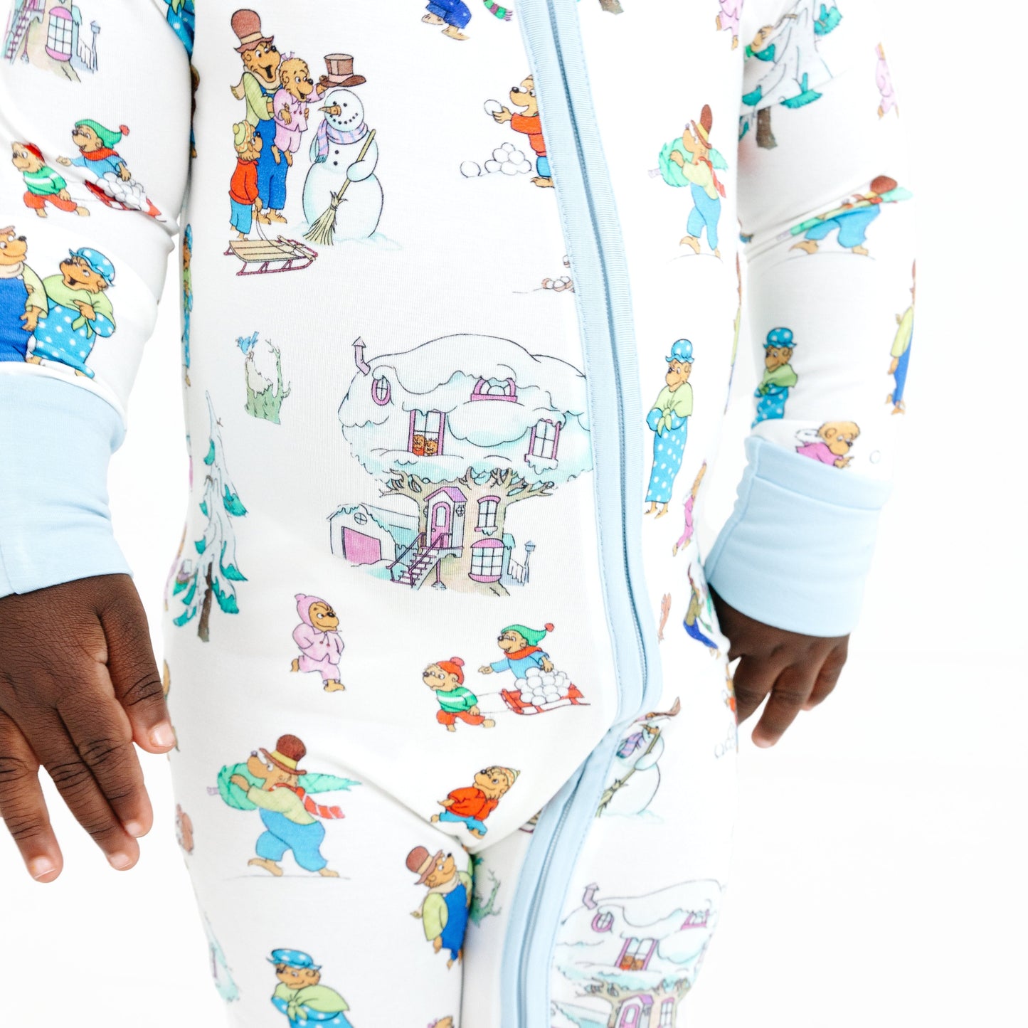 Children's onesie with cartoon character print on a white background