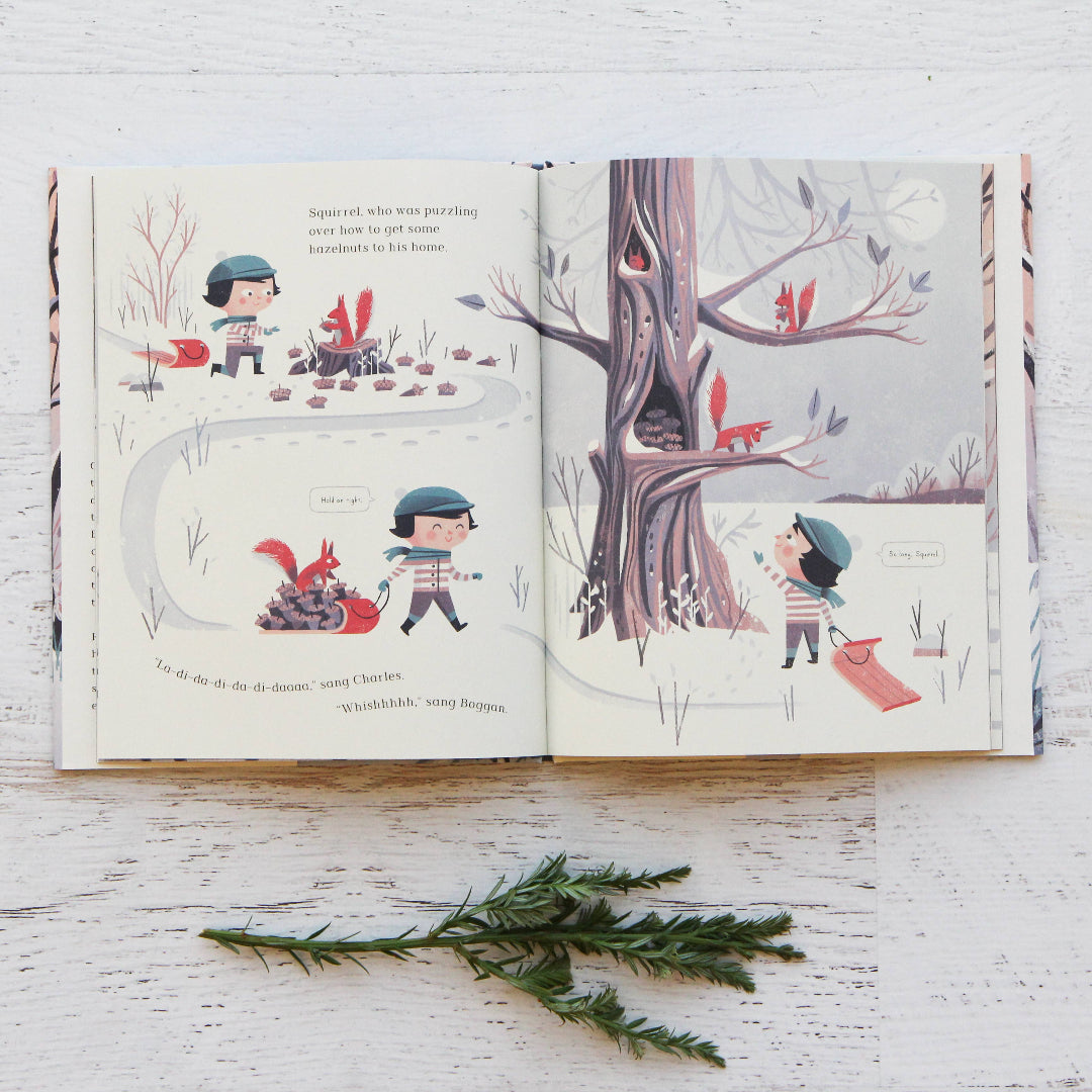 Open book with illustrations of a child and animals on a wooden surface.