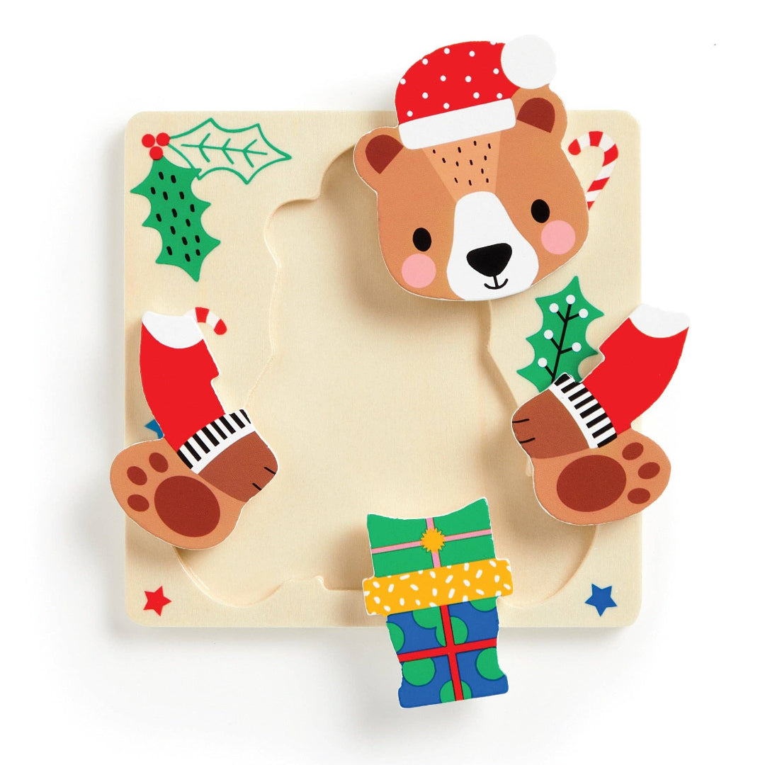 Wooden puzzle with a bear design and Christmas elements on a white background
