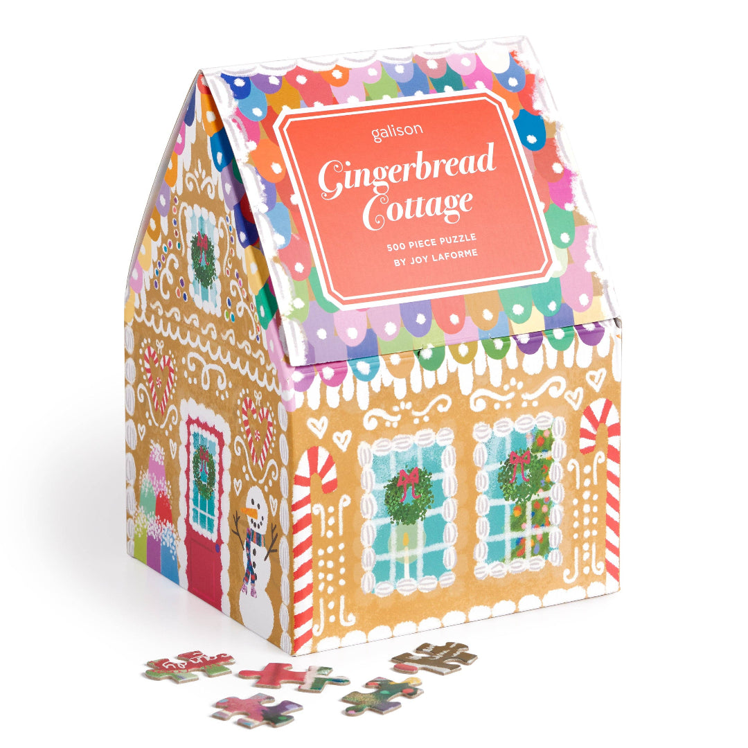 Gingerbread cottage-shaped puzzle box with colorful design on a white background