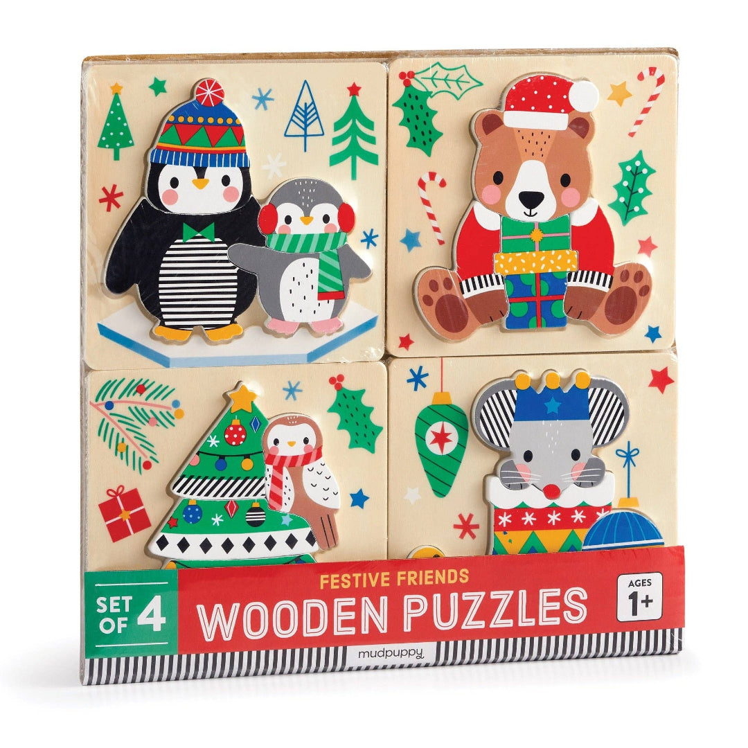Set of 4 festive wooden puzzles with Christmas-themed illustrations on a white background