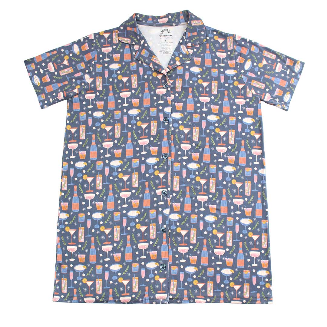 A short-sleeved women's nightgown with a button-down front featuring a pattern with various cocktails and wine glasses on a dark background.
