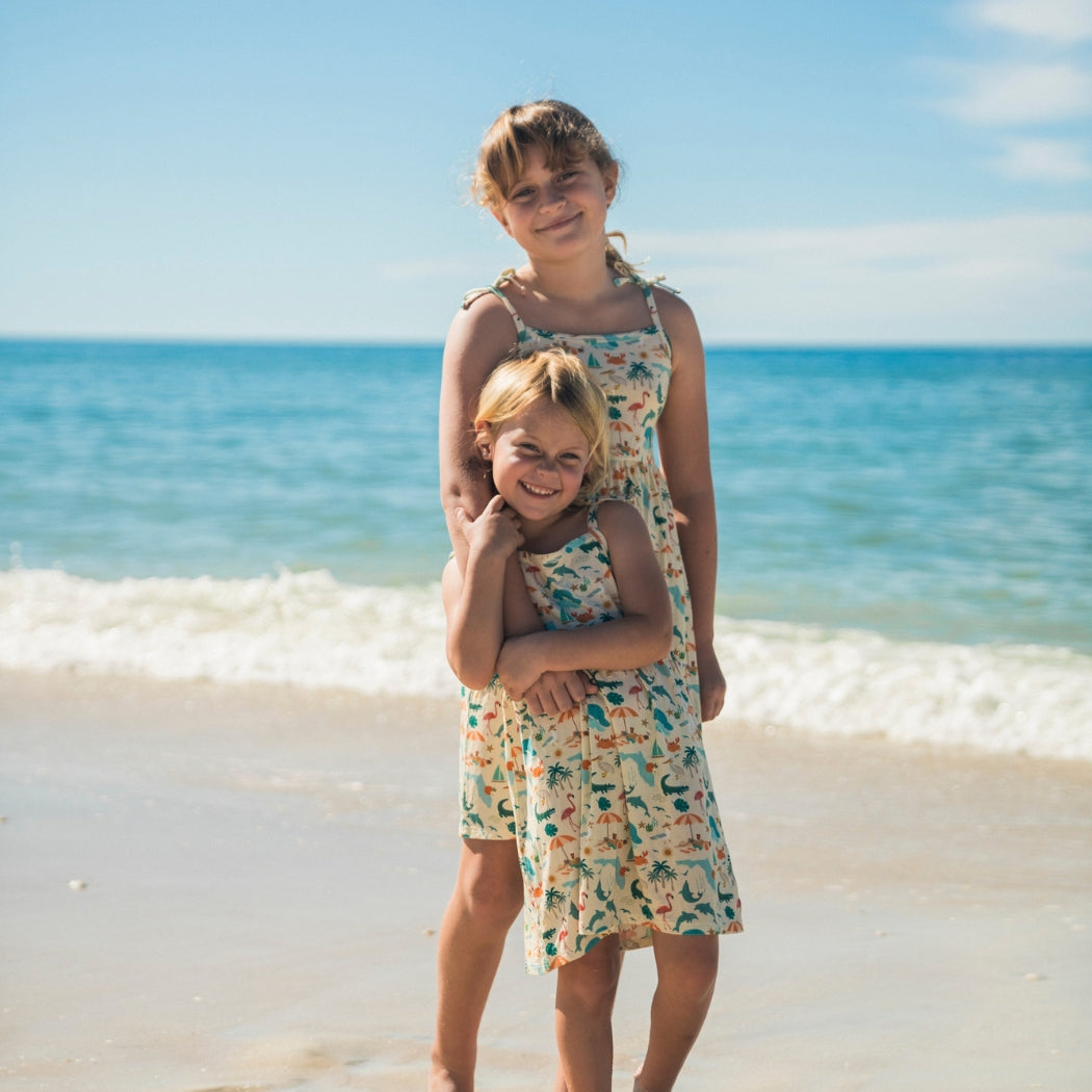 Soft and breathable bamboo day dress featuring a vibrant Florida-themed print and adorable tie shoulders, perfect for babies, toddlers, and kids to wear in comfort and style.