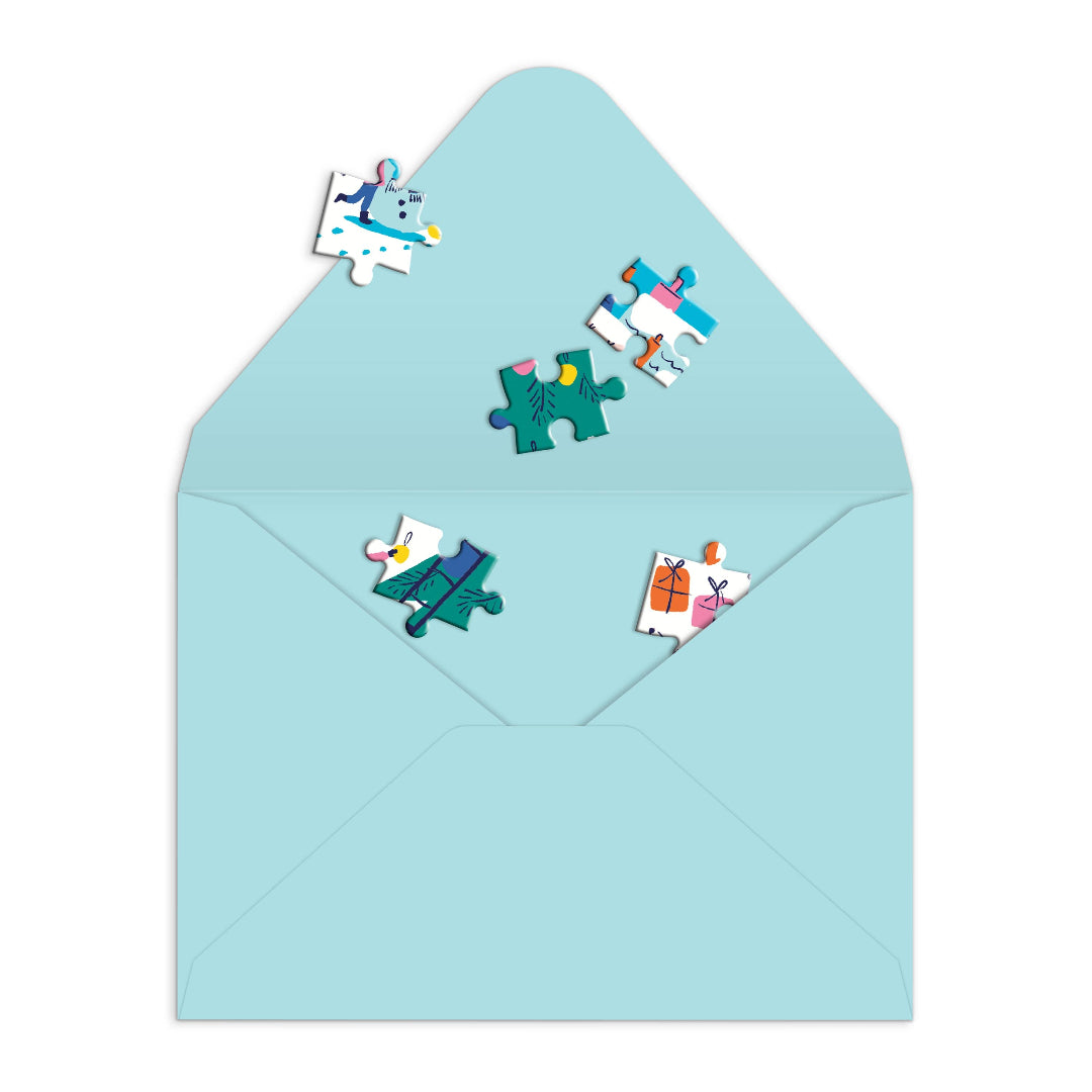 Colorful puzzle piece stickers on a light blue envelope