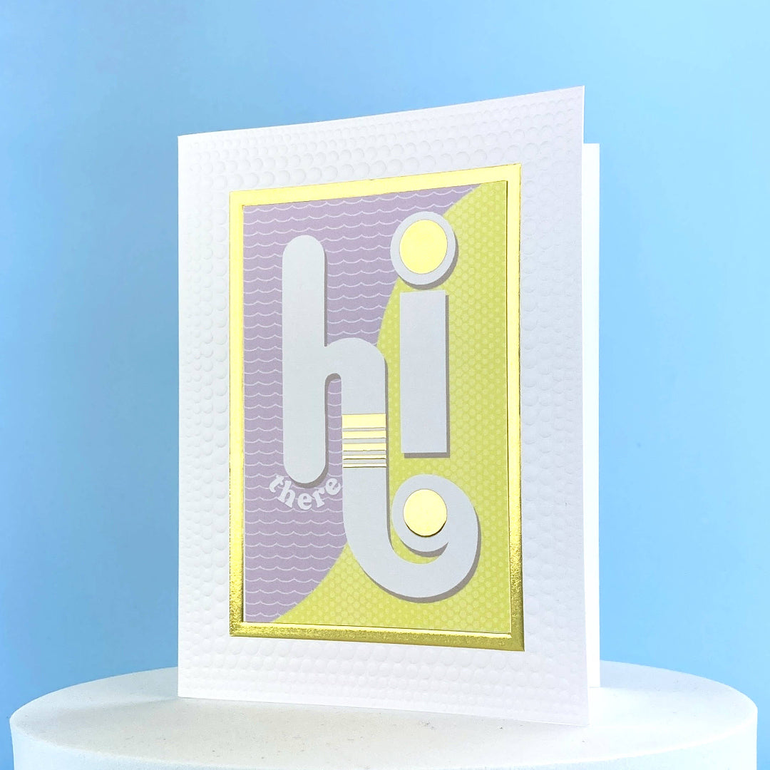 purple and green card that says Hi there on the front