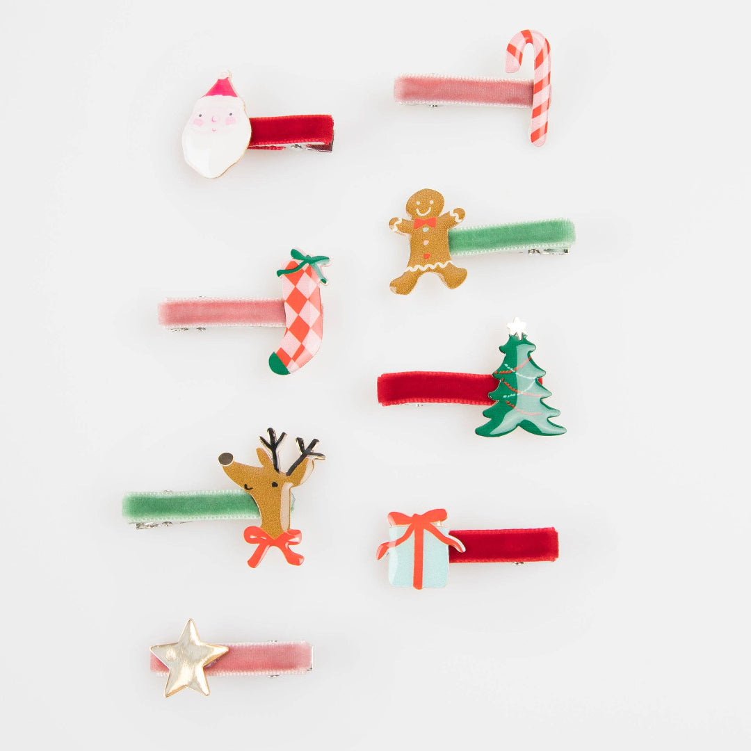 Set of Christmas-themed hair clips on a white background
