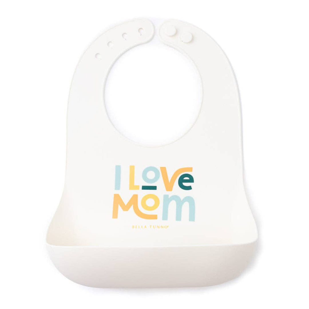 white silicone bib that reads I love mom