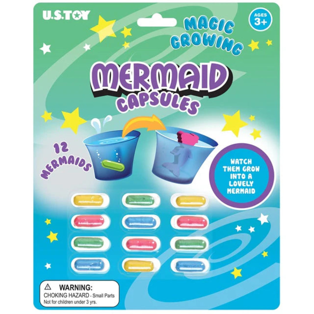 Packaging of U.S. Toy Magic Growing Mermaid Capsules with colorful mermaid figures and stars on a blue and green background.