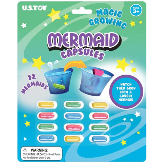 Packaging of U.S. Toy Magic Growing Mermaid Capsules with colorful mermaid figures and stars on a blue and green background.