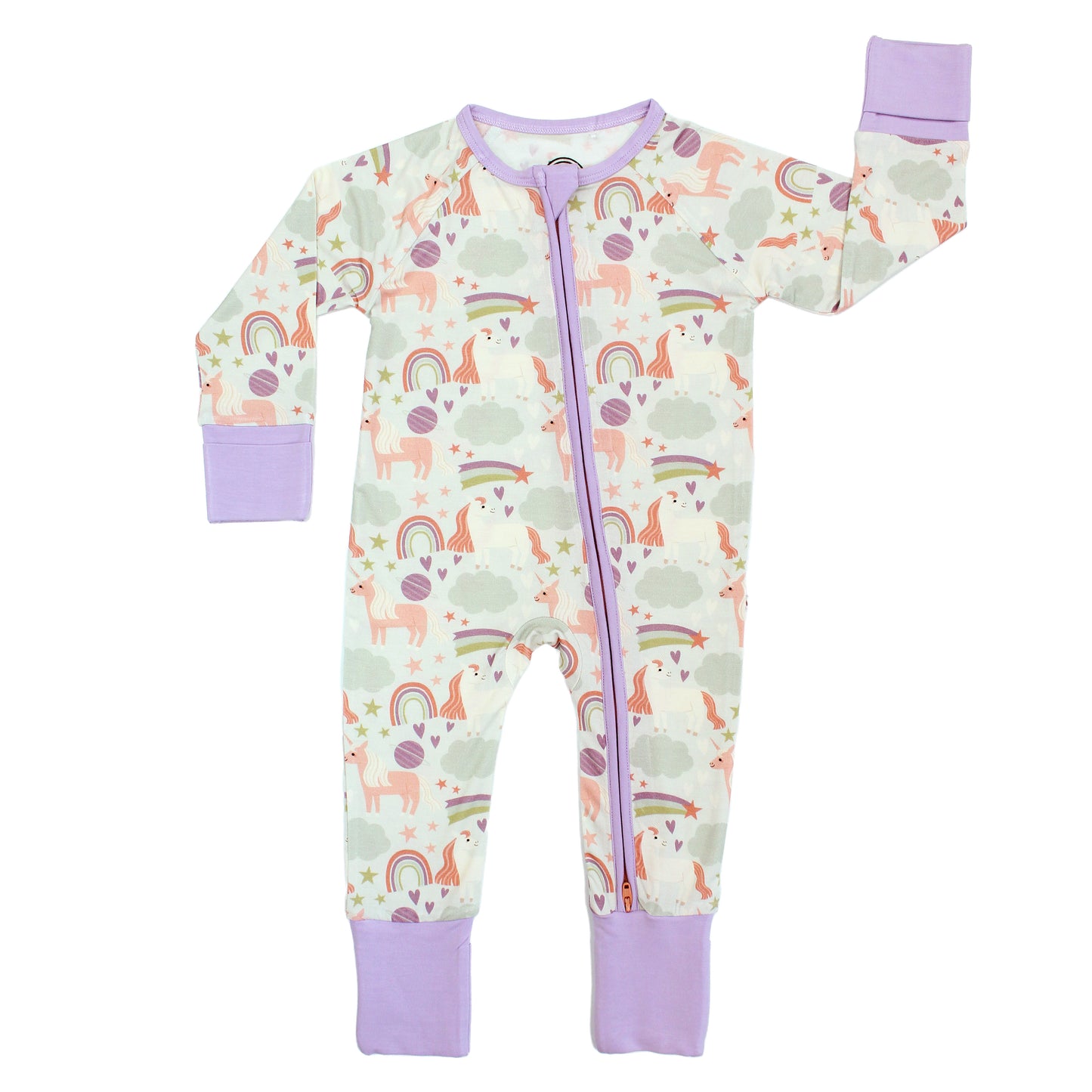 Flat lay of our Magical Unicorn Bamboo Convertible Pajama. The print includes unicorns, rainbows, clouds, planets, stars, and hearts. The colors are purple, pink, and blu, with hints of green.