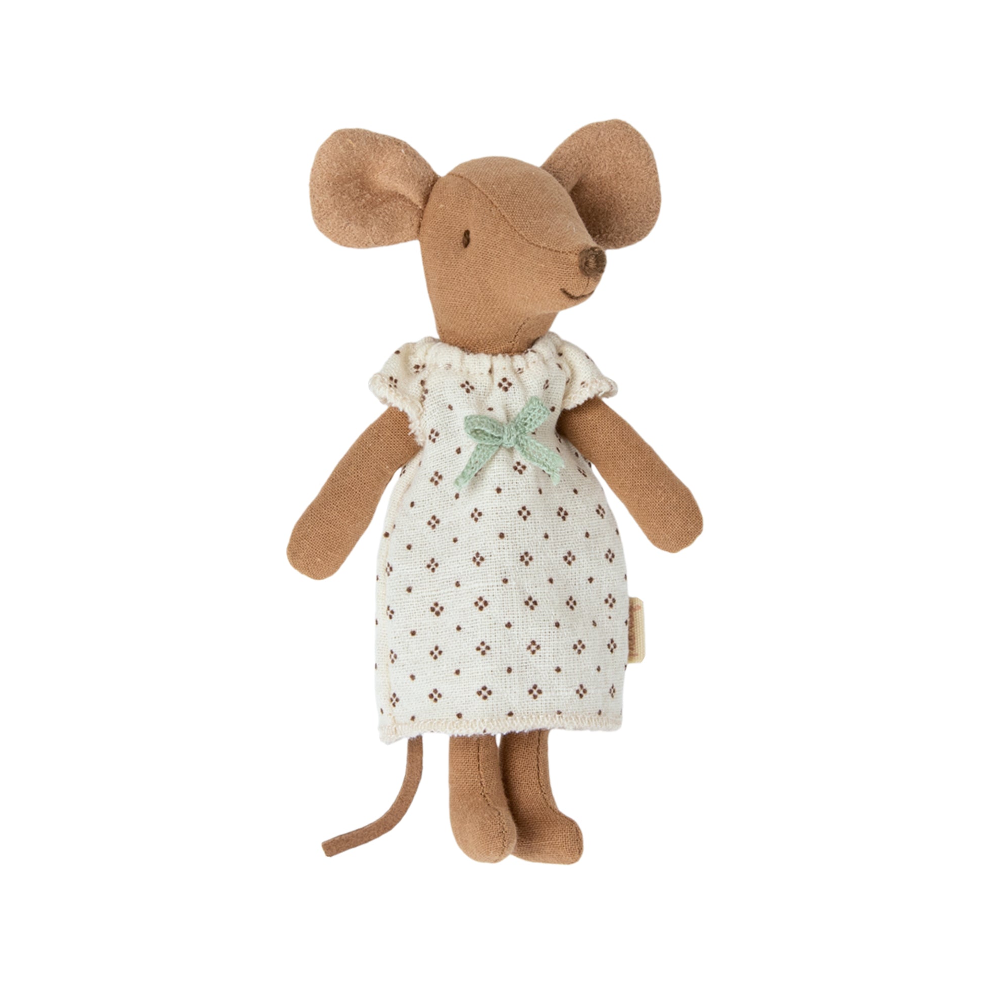 Stuffed mouse toy wearing a white dress with a green bow on a white background