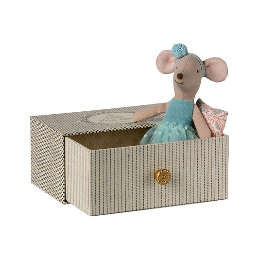 Stuffed mouse toy in a decorative box on a white background