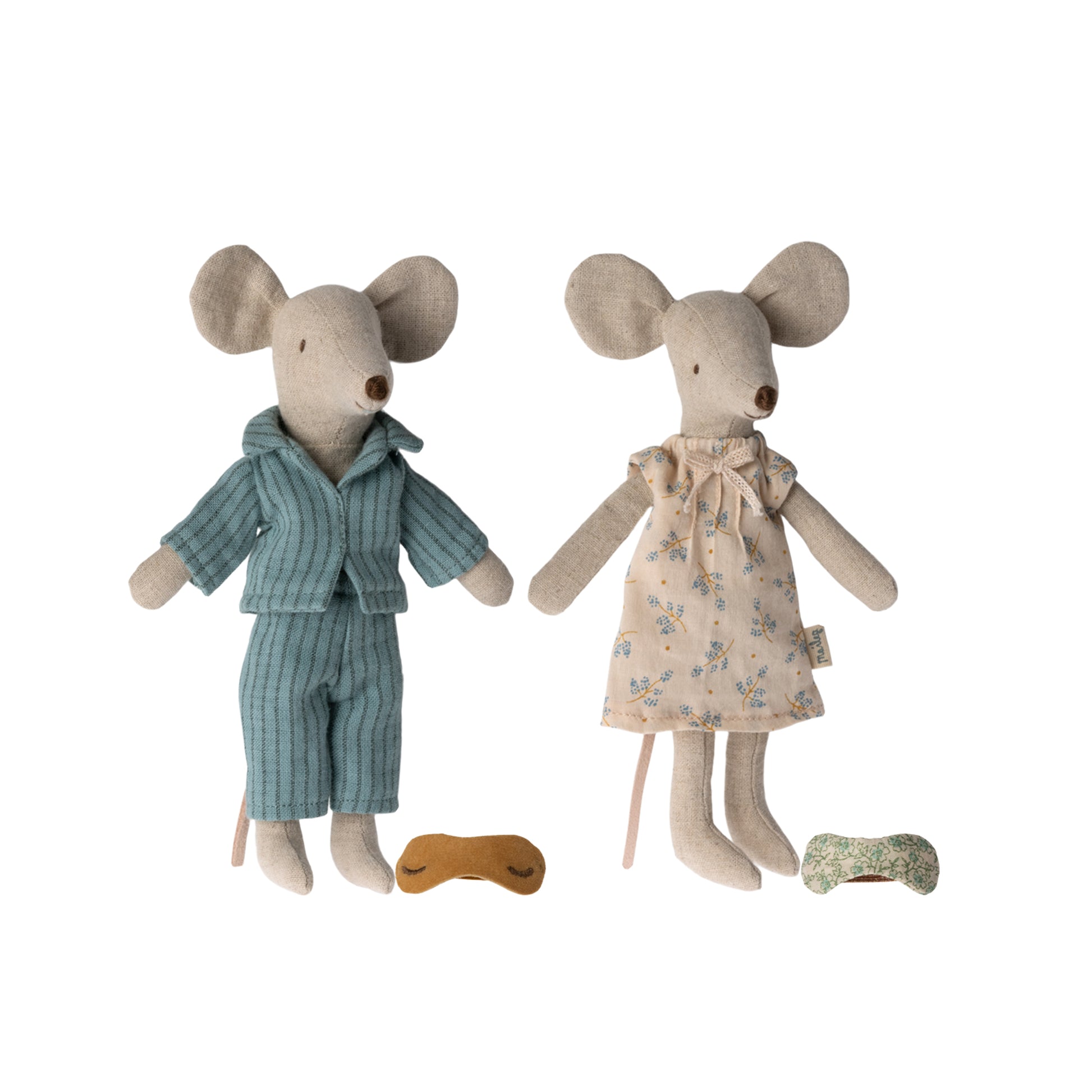 Two toy mice, one in pajamas and the other in a dress, on a white background.