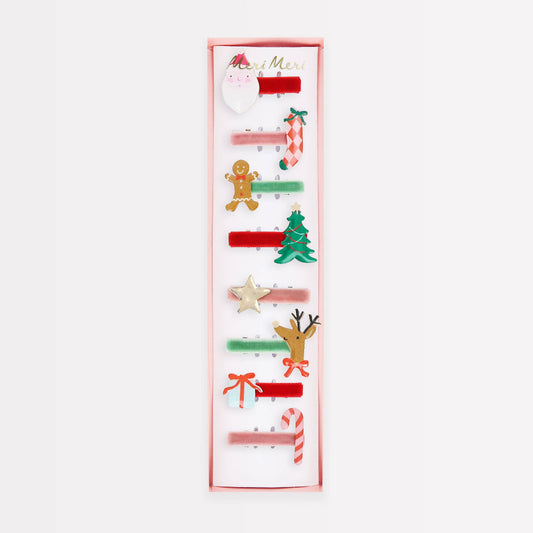 Set of Christmas-themed hair clips on a white background