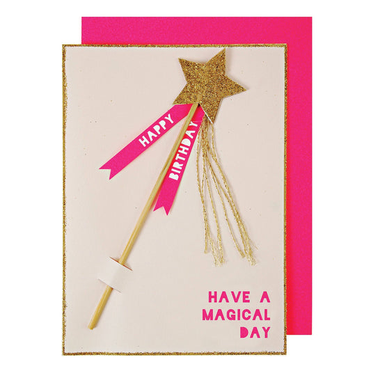 Birthday card with a gold glittery wand and pink ribbons on a white background