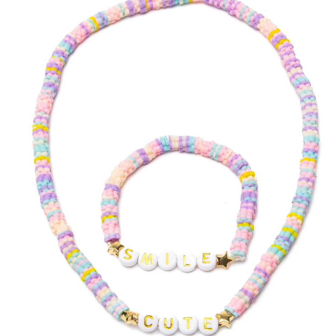 Pastel beaded necklace and bracelet set with letter beads spelling "Cute" and "Smile" from Great Pretenders