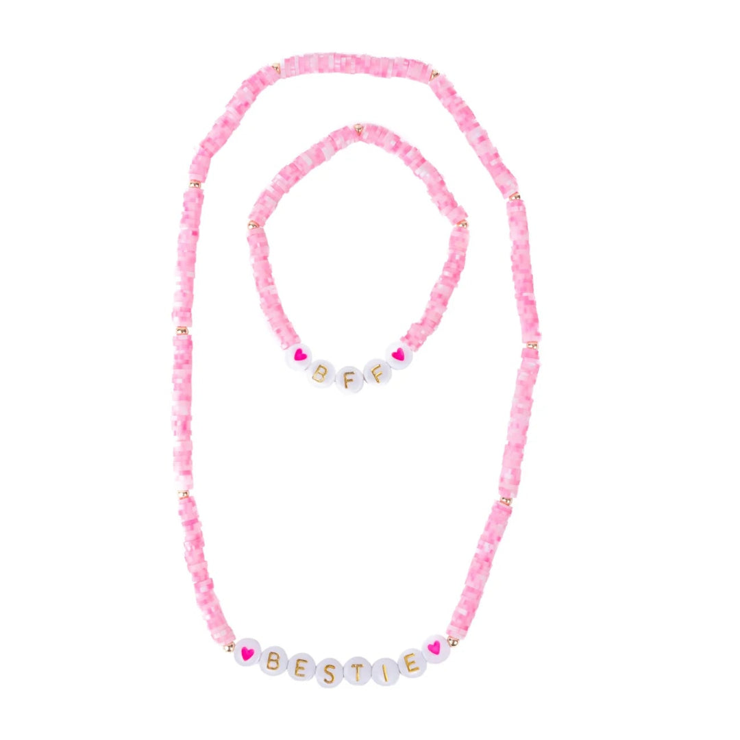 Pink and white beaded necklace and bracelet set featuring "BFF" and "BESTIE" letter beads from Great Pretenders