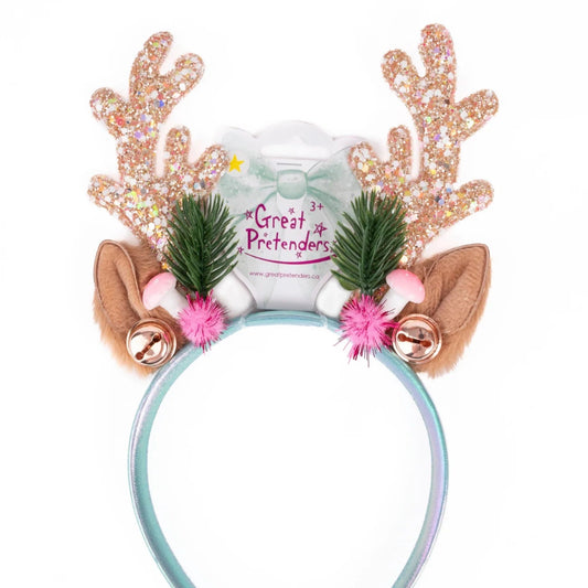 Decorative Rudolph antler headband with sparkly reindeer antlers, bells, sprigs of spruce and pink pompoms from Great Pretenders