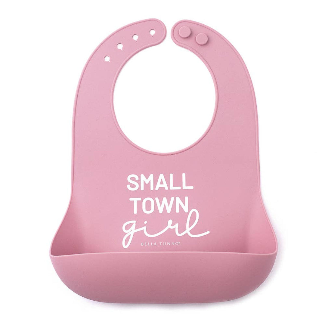 light pink bib that says small town girl