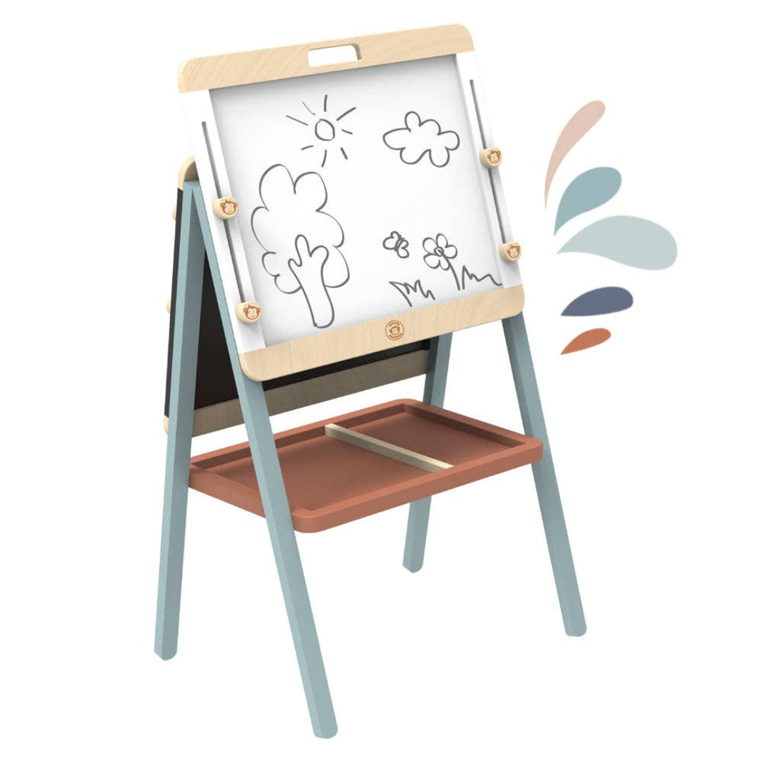 a wooden adjustable art easel that has a white board with a drawing in black marker of a tree, sunshine, cloud, and flowers with a butterfly