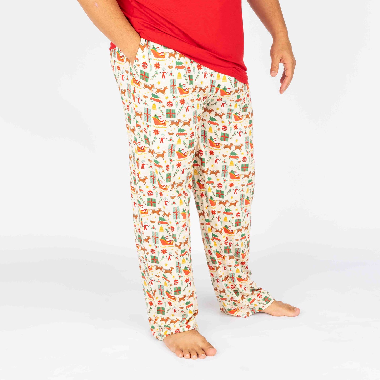 A person wearing vintage Christmas patterned bamboo lounge pajama pants with a relaxed fit.