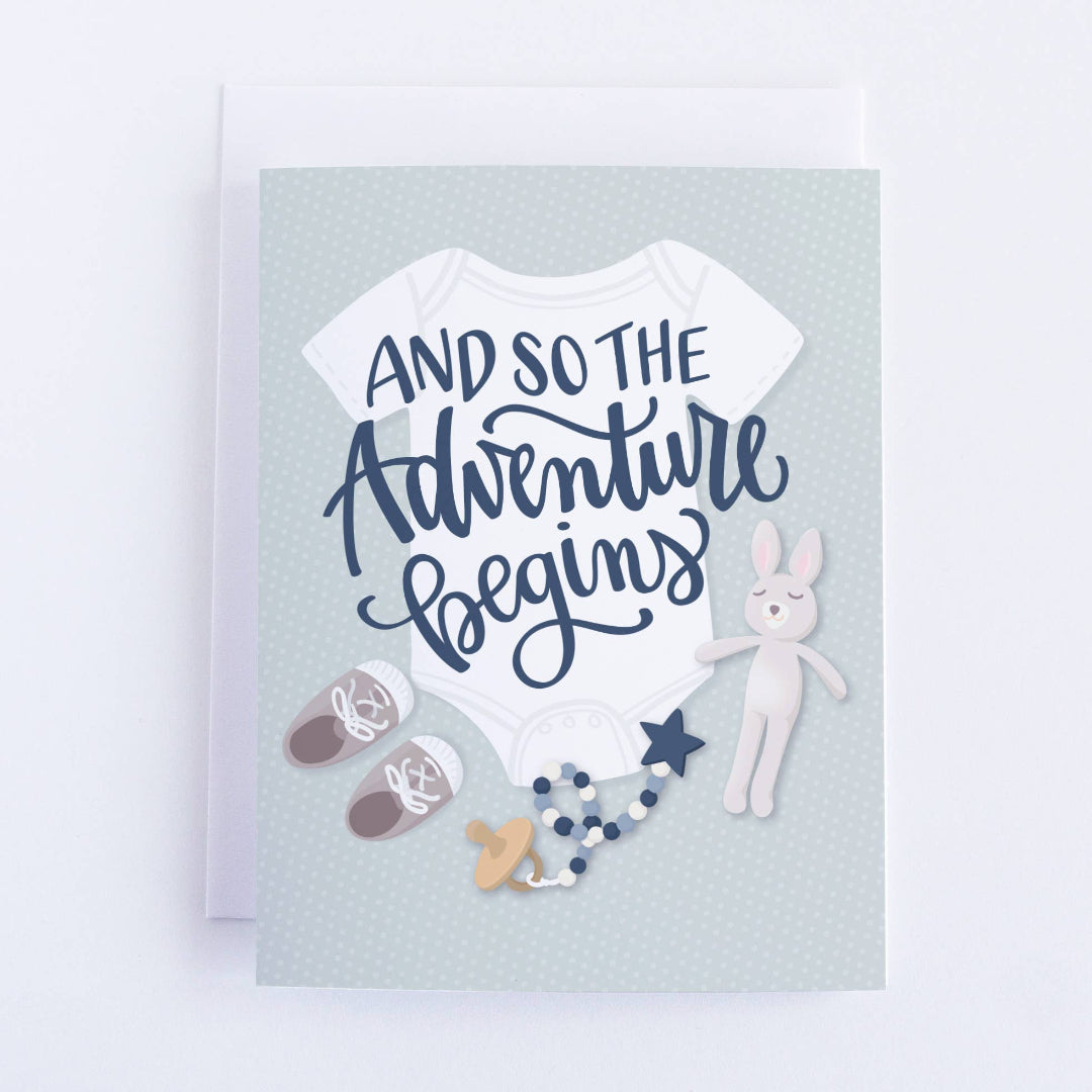 gender neutral baby shower card that says and so the adventure begins
