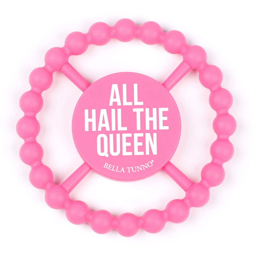 silicone round teether thats pink and says all hail the queen