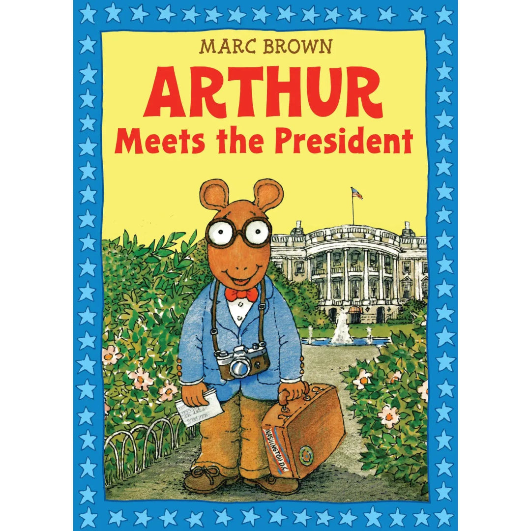 Arthur standing outside of the White House with a briefcase in his hand and a camera around his neck