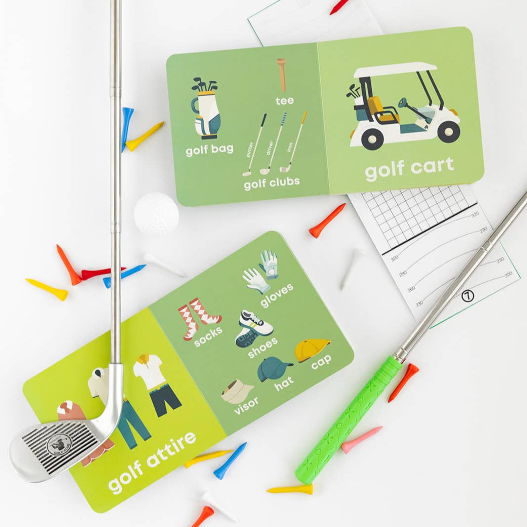 Educational golf-themed flashcards on a white surface with golf accessories.