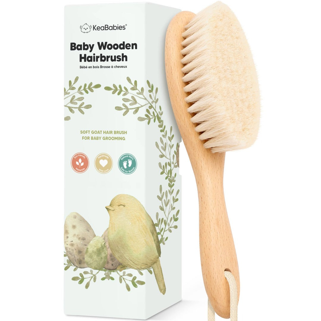 a wooden hairbush made for babies and green box with a bird and eggs image