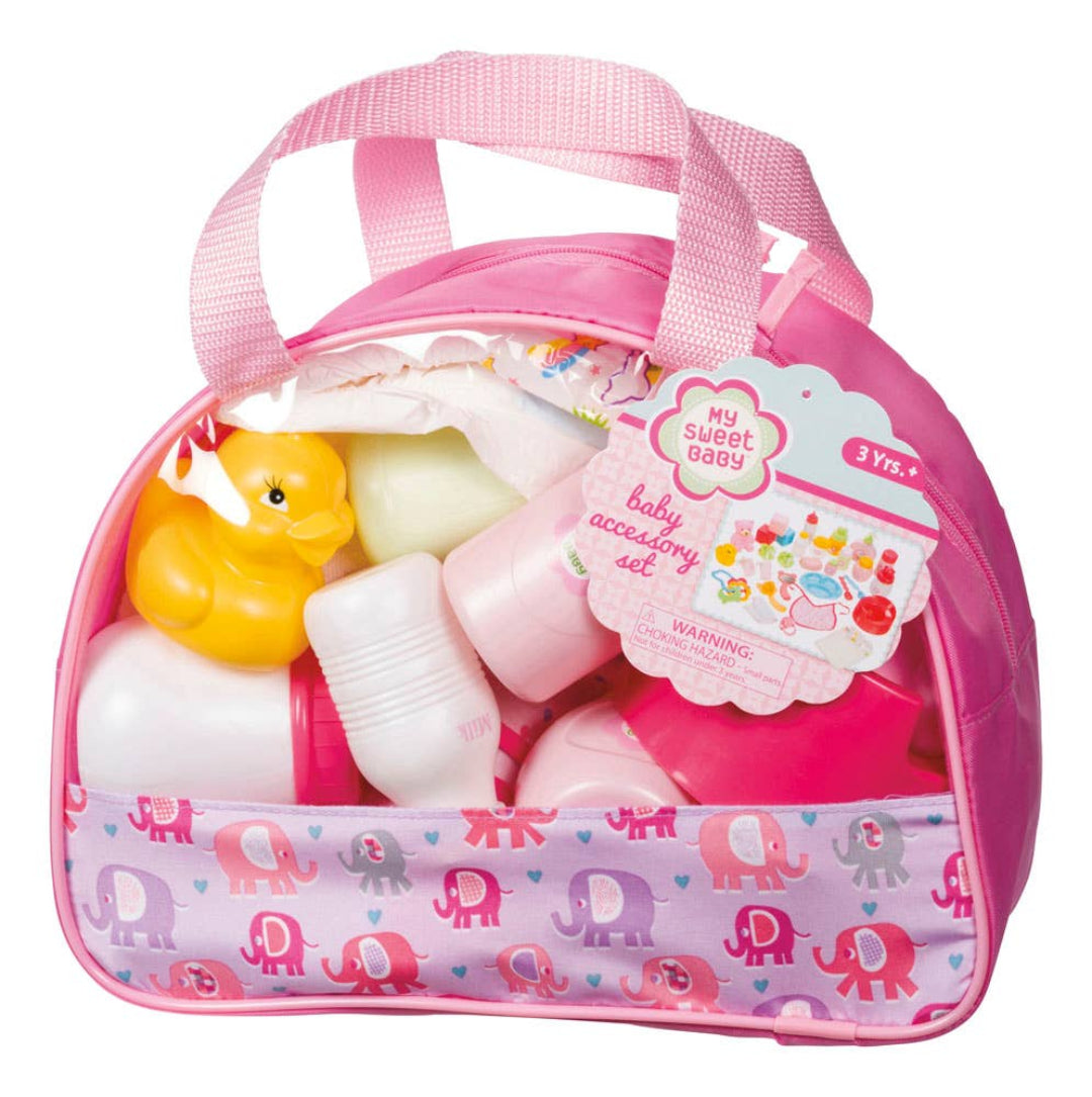 baby accessory set including bottles, feeding supplies, toys, and more in a pink and clear carry bag