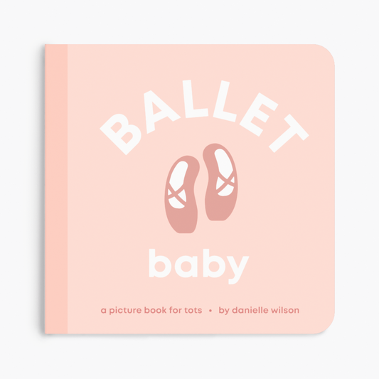a pink book with ballet shoes in the center of the book cover