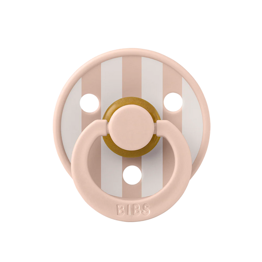 blush and white colored baby pacifier