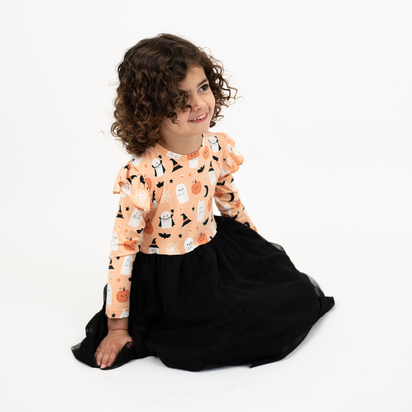 Boo-Tastic Halloween bamboo dress with soft black tulle skirt and spooky print of ghosts, pumpkins, bats, and witch hats.