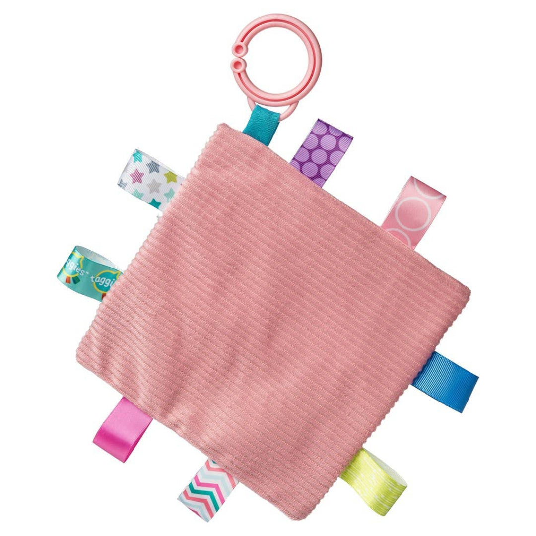 square fabric baby toy with lots of tags around the outside for babies to play with