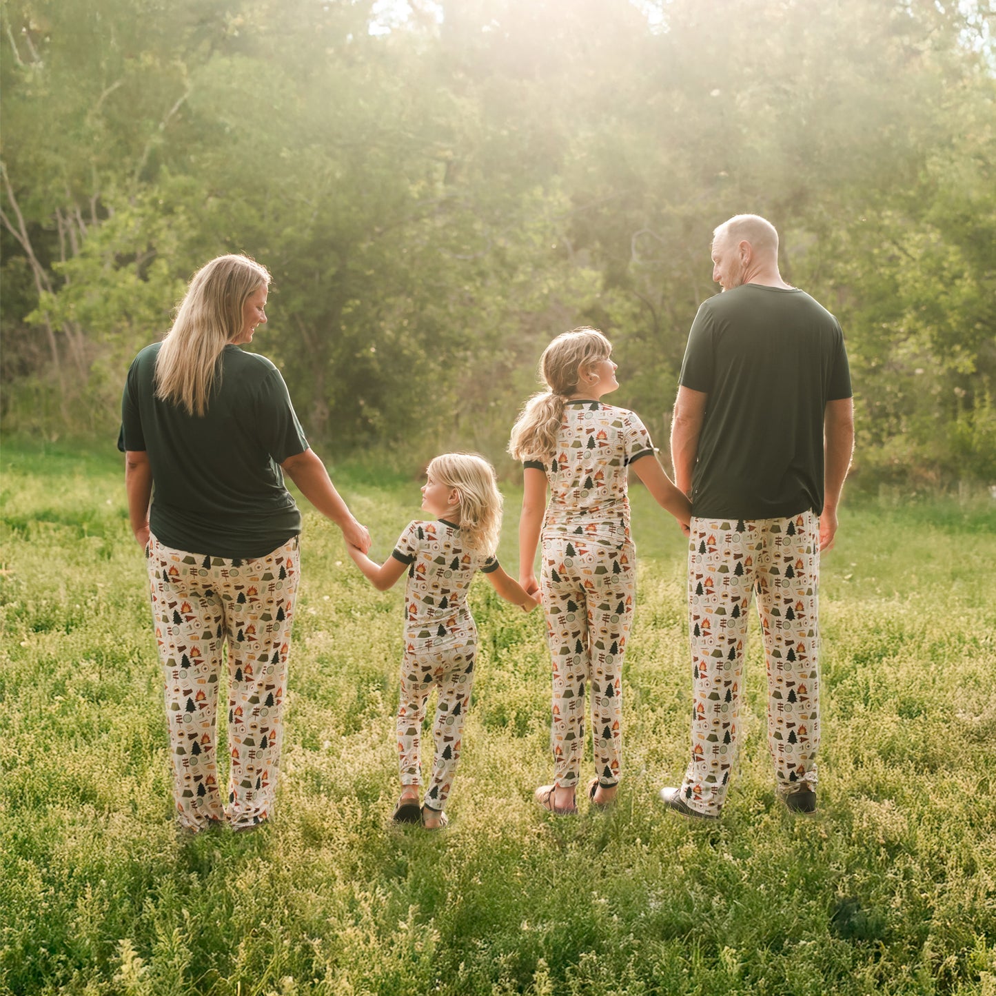 Family walking in a field wearing Camp Emerson bamboo lounge pants.
