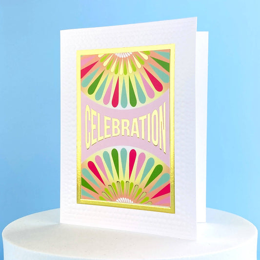 Greeting card that says Celebration on the front and has multi colored designs on it