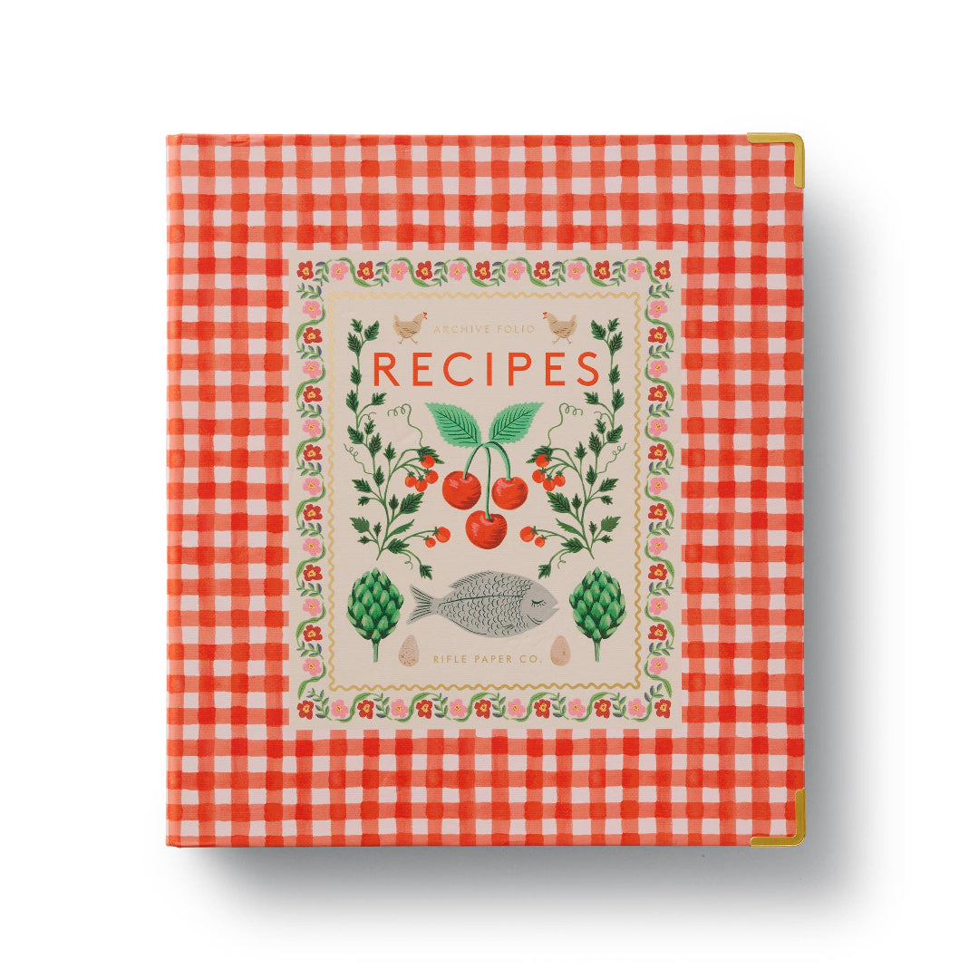 a recipe book binder thats red plaid with cherries on the cover