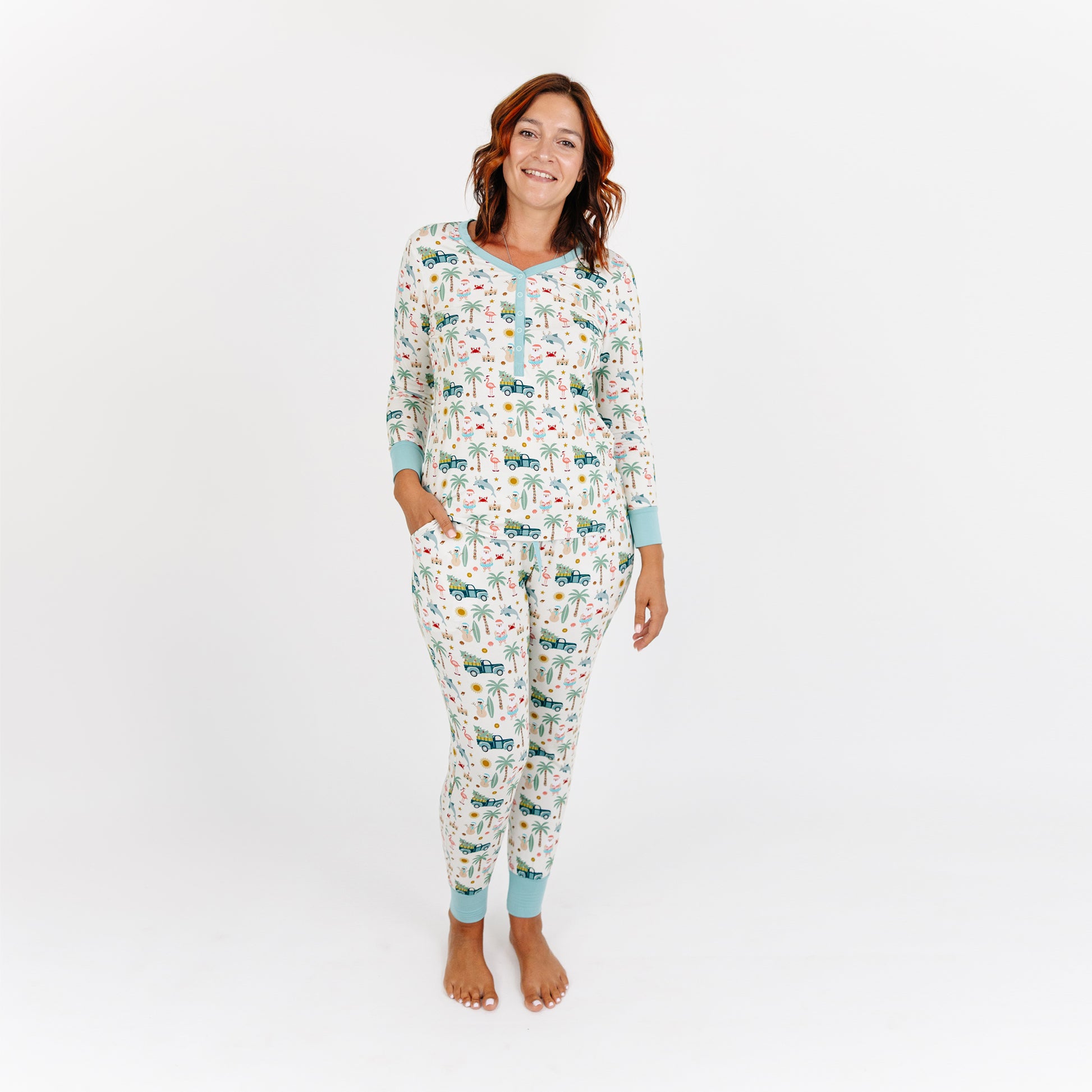 Woman wearing a patterned onesie on a white background