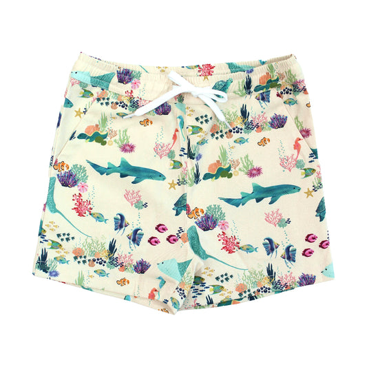 Emerson and Friends Coral Reef Boys Swim Trunks, featuring a vibrant ocean-themed design with sharks, sea turtles, and coral, made from quick-dry fabric with UPF sun protection for all-day beach and pool fun.