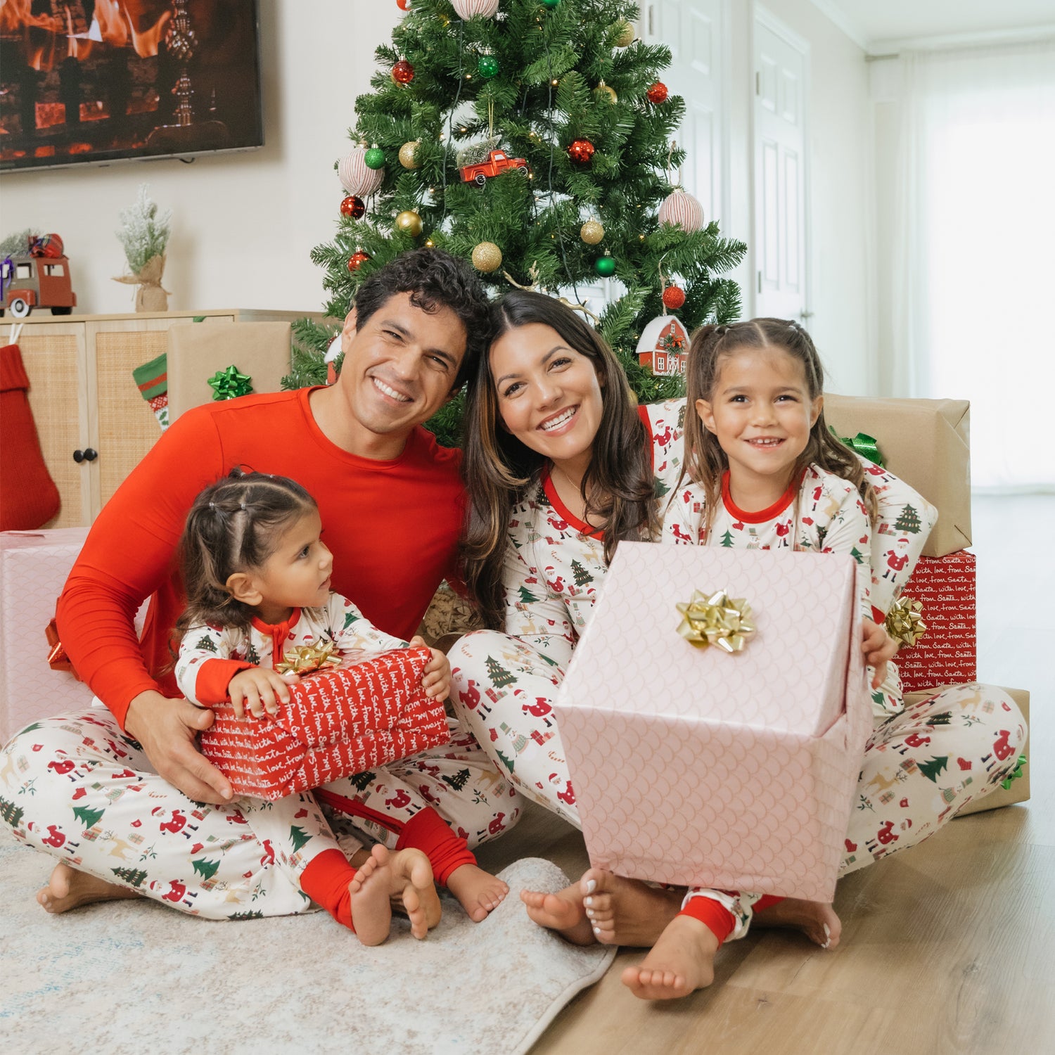 Family poses together in matching Cozy Christmas bamboo relaxed fit pants, perfect for holiday lounging and matching moments.