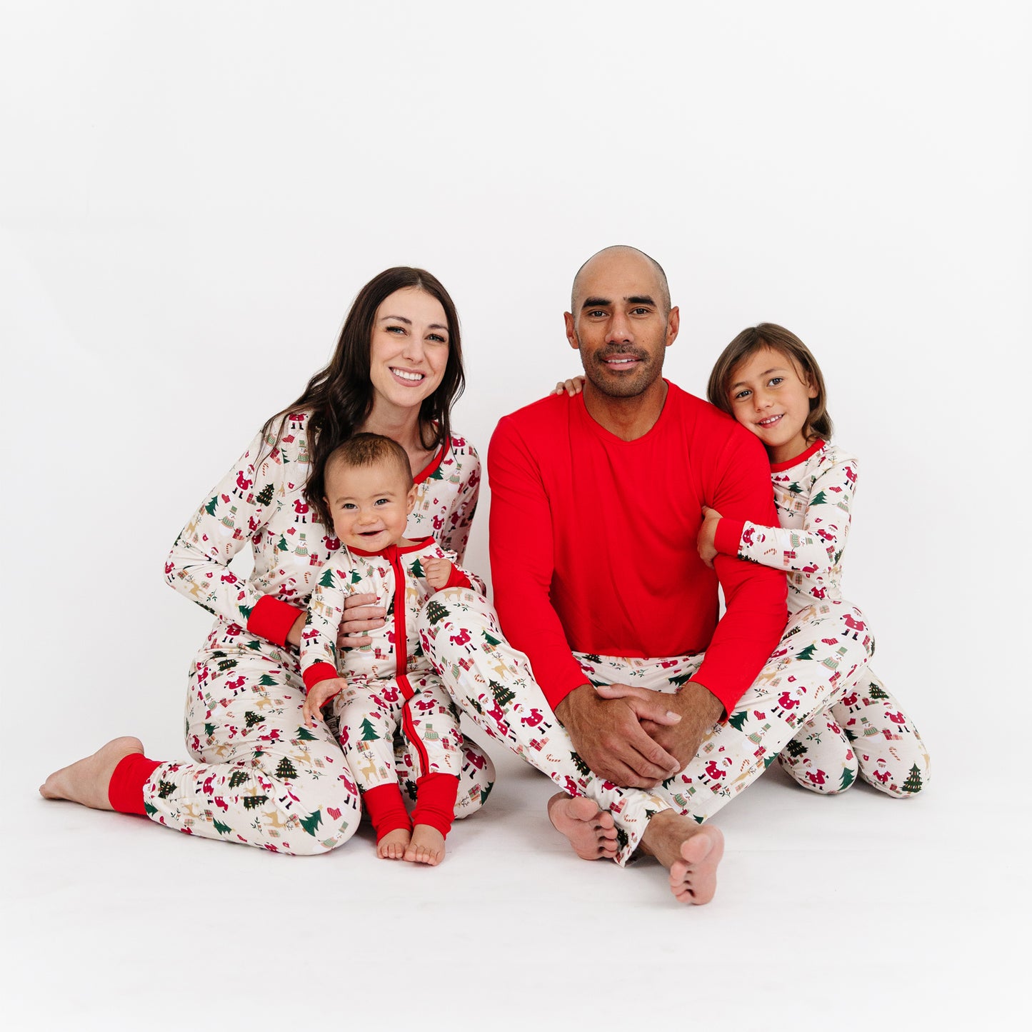 Family poses together in matching Cozy Christmas bamboo relaxed fit pants, perfect for holiday lounging and matching moments.