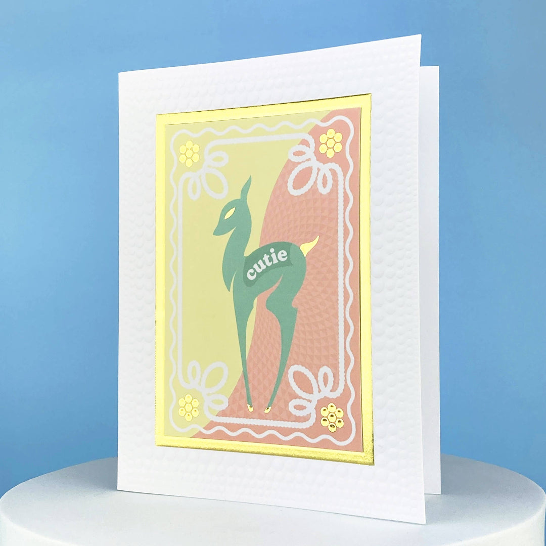 greeting card that says cutie on it and has a deer on the front