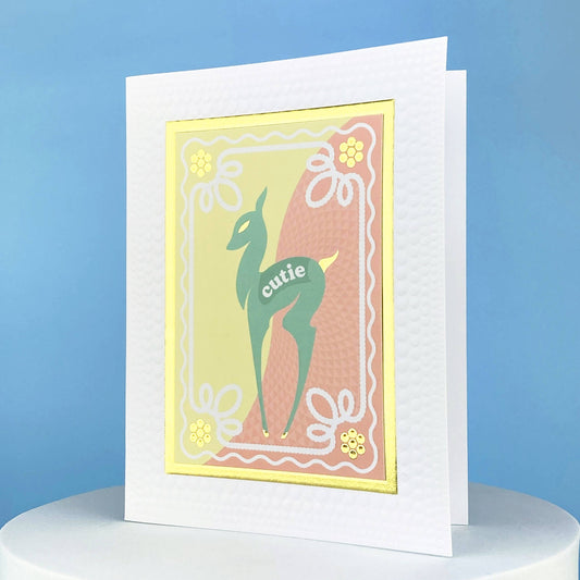greeting card that says cutie on it and has a deer on the front