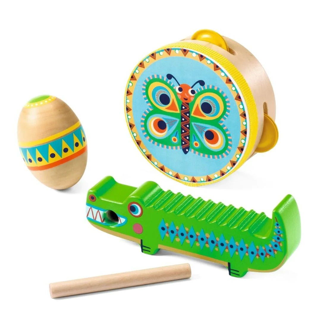 Set of colorful wooden toys including a tambourine, egg shaker, and alligator rattle on a white background.