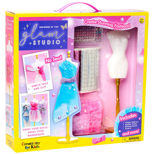 Glam Studio toy set packaging with mannequin, fabric, and accessories.