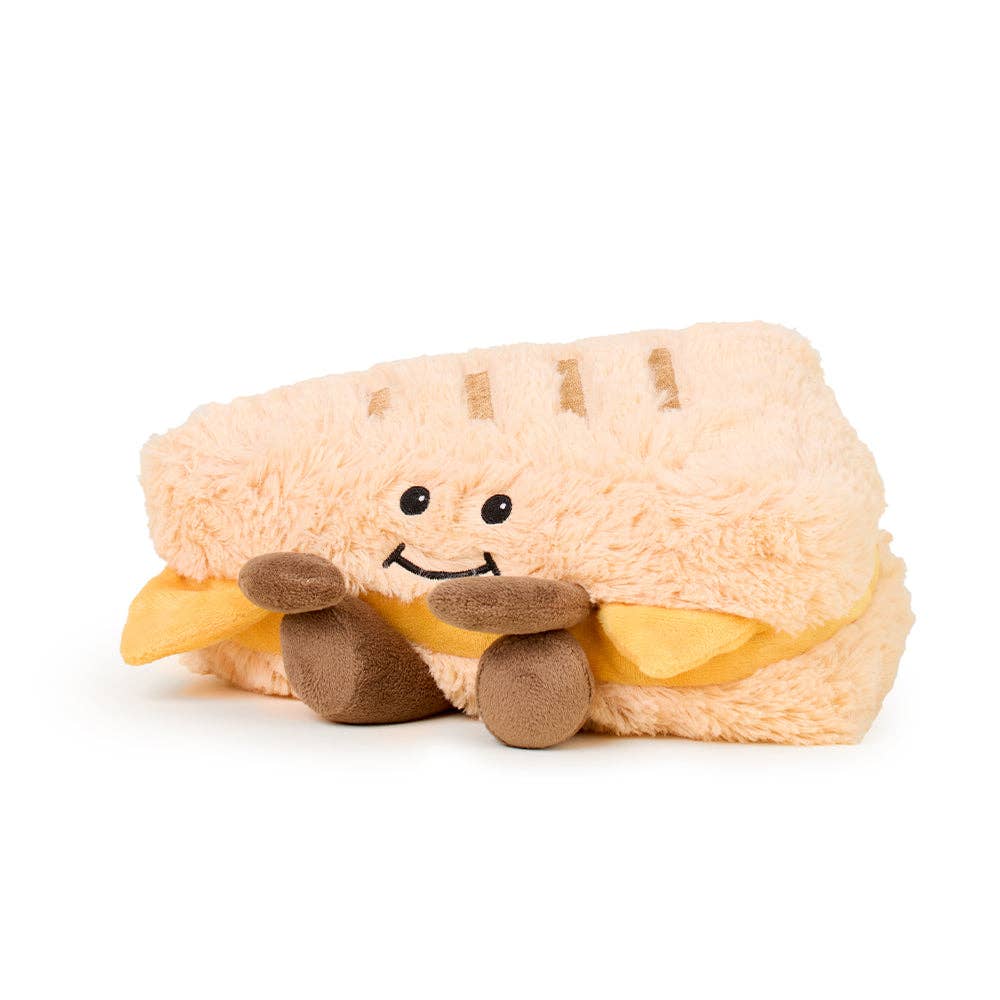 Plush toy shaped like a hot dog with a smiling face on a white background