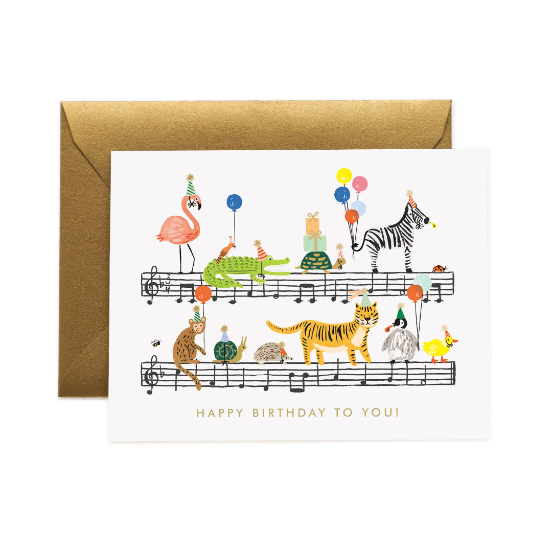 birthday card with written music and animals on the front